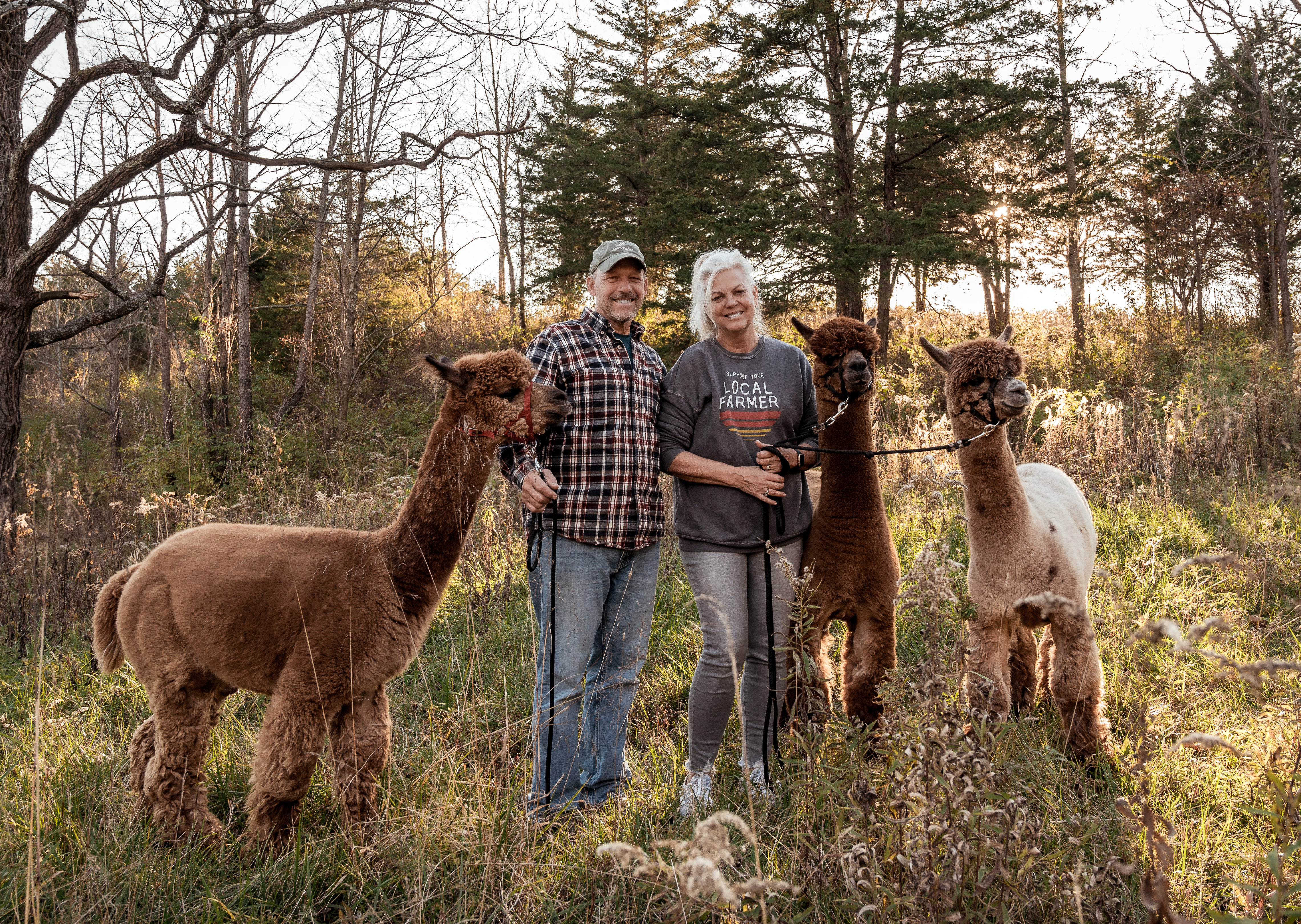 Annette and Rick with alpacas at Count Your Blessings Farm